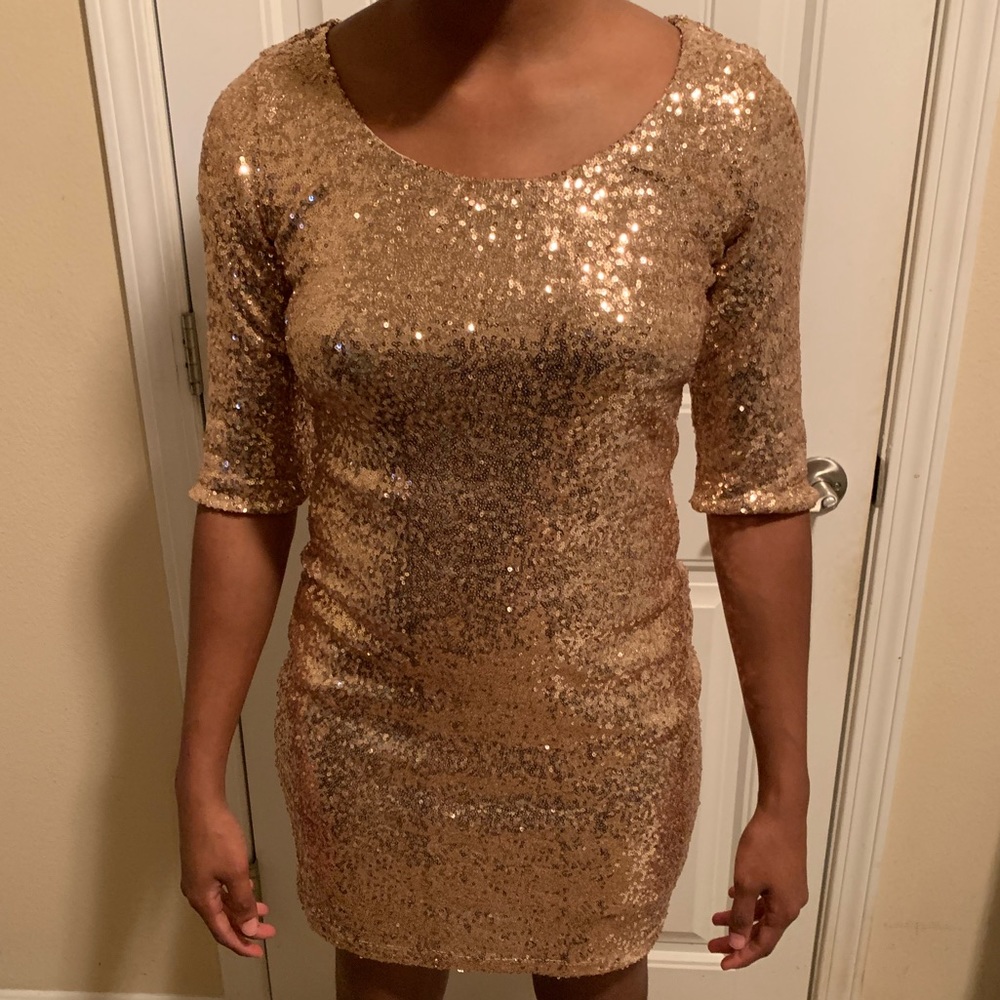 A rose gold sequin fitted dress